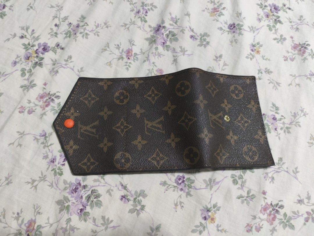 Louis Vuitton Monogram Trifold Wallet With Box (Category: Luxury Bags & Wallets) located in Lucena. Submitted by cha_riz010726 (Listing ID 1466442278, Image 2). Description: - Stylish monogram print canvas exterior with a dark interior - Compact tri-fold design that easily fits into bags and pockets - Features multiple card slots and a convenient ID window - Secure orange snap button closure on the front flap - Keeps cards and cash organized for 