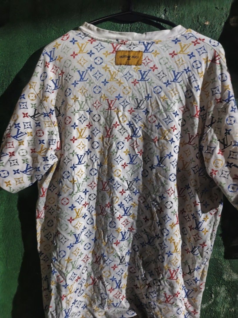 Louis Vuitton Multicolor Monogram T-Shirt White (Category: Tshirts & Polo Shirts ) located in Caloocan City. Submitted by billabong09 (Listing ID 1466371183, Image 1). Description: - Authentic designer style: White t-shirt featuring the iconic multicolored Louis Vuitton monogram pattern - Premium comfort: Crafted from soft, breathable cotton in a relaxed fit with short sleeves - Signature details: Includes a blue inner neck tag with yellow 'Louis