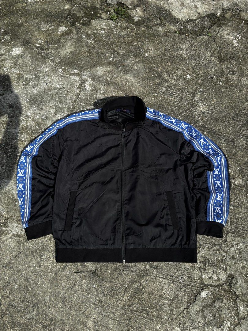 Louis Vuitton Track Jacket Black with Blue Monogram Sleeves (Category: Coats, Jackets and Outerwear) located in Caloocan City. Submitted by neweagle-424b (Listing ID 1466399242, Image 2). Description: Dimes : - ( W 24 x 26 L ) color rate - 9.5 very good condition ✅ issue ❌pin hole sleeve nasa pic pa double check - Color: Black with blue monogram patterned sleeves - Hardware: Louis Vuitton branded zip pull - Features: Full zip closure, ribbed stan