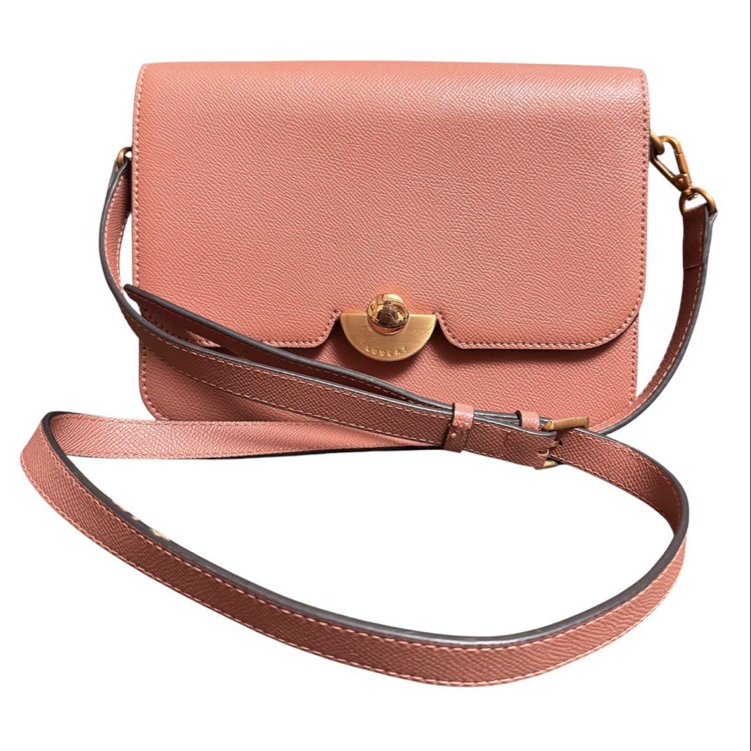 LovCat Shoulder Bag (Category: Cross-body Bags) located in Baguio. Submitted by pwz-eshop (Listing ID 1466392068, Image 1). Description: • Up for Grabs!! • Guaranteed Authentic!! • Flaws: Hairline scratches on hardware. (please see photos) • BRAND: LOVE CAT. • DIMENSIONS: length 9", height 6.5", width 3.5", handle drop: 21". • SERIAL NUMBER: None. • COUNTRY OF ORIGIN: Undetermined. • MATERIAL: Saffiano Leather. • COLOR: Pink/old rose. • Lining: C