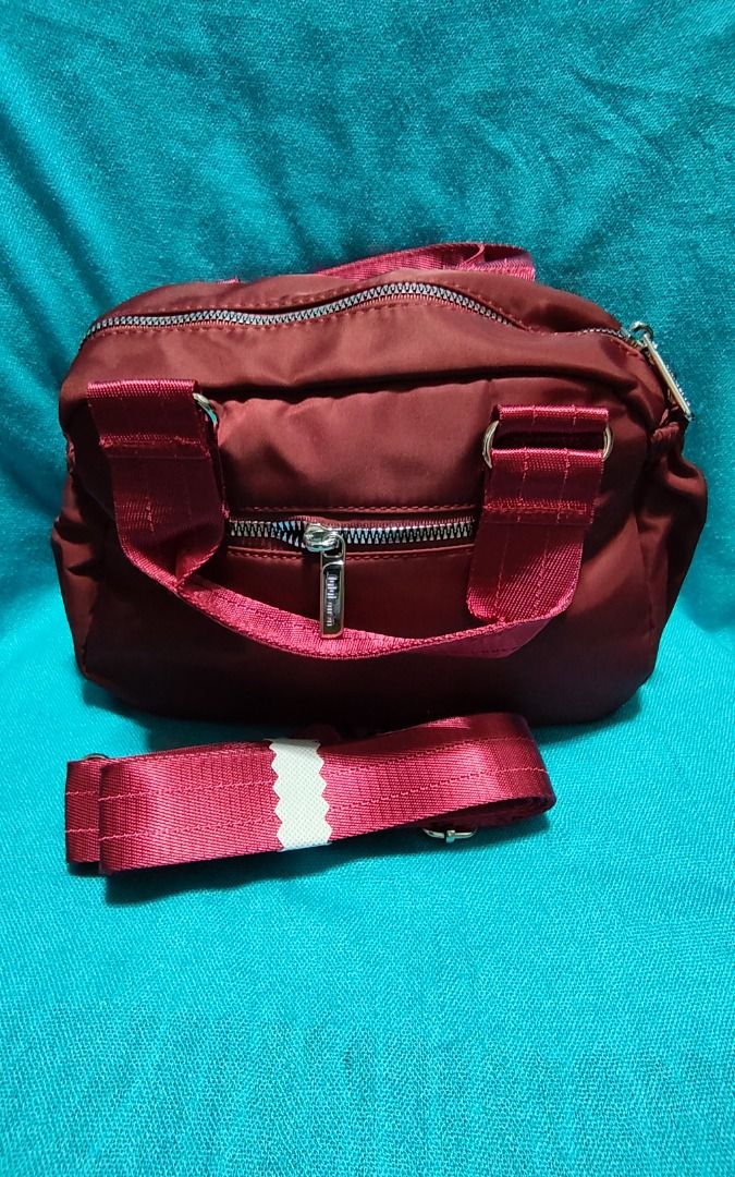 Lulu Lémøn Hand / Sling Bag Maroon (Category: Cross-body Bags) located in Las Pinas. Submitted by jpmshoppe (Listing ID 1466479076, Image 2). Description: Hand Bag with detachable sling strap Maroon in color Very spacious inside 3 outer zipper pockets and 2 side open pockets.