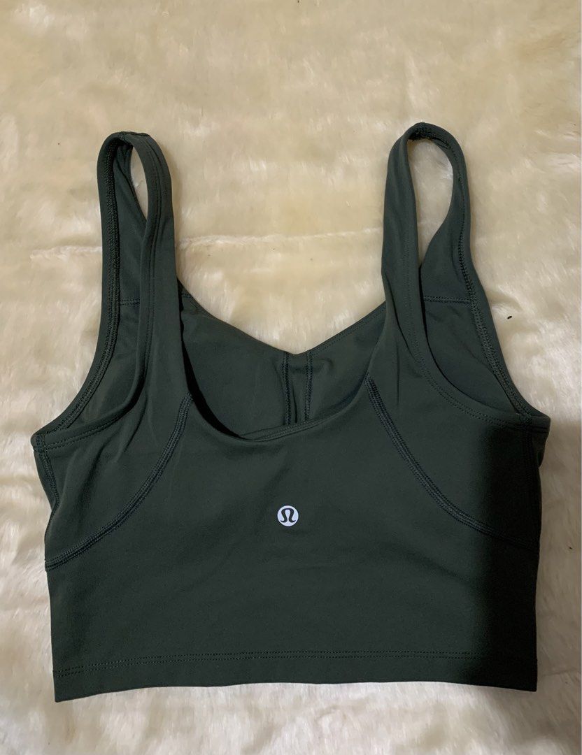Lululemon Dark Green Align Tank Top (Category: Sleeveless) located in Bayombong. Submitted by birkensaddiction (Listing ID 1466339195, Image 1). Description: - Brand: Lululemon - Color: Dark green - Style: V-neck with trendy multi-strap cutout back - Support: Built-in shelf bra included - Details: Signature white omega logo at the back neckline - Condition: Tag intact, soft and stretchy fabric - Ideal for: Gym, yoga, or everyday activewear -S on 