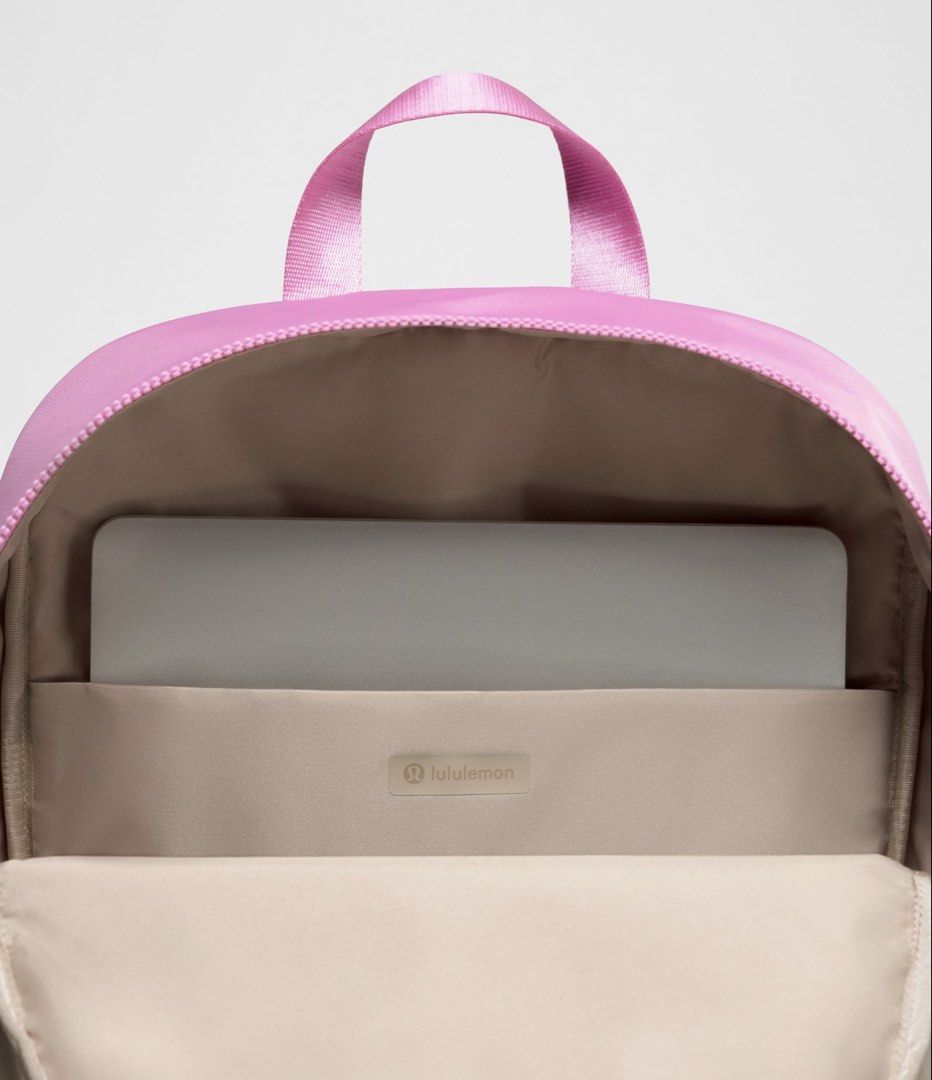 Lululemon Everyday Backpack 22L (Category: Backpacks) located in Muntinlupa City. Submitted by peachonlineshop (Listing ID 1465378179, Image 3). Description: - Brand: Lululemon - Color: Sweet Sorbet & Cherry ember - Material: Smooth, durable fabric - Design: Clean minimalist style with front zip pocket and brand logo - Storage: Large main compartment for all your daily essentials - Comfort: Top carry handle and adjustable shoulder straps - Versat