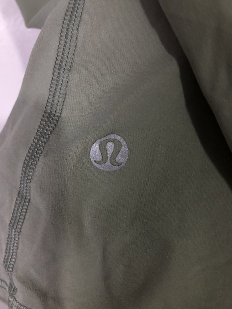 Lululemon Green Athletic Tank Top (Category: Activewear) located in Quezon City. Submitted by clarizedeo09960 (Listing ID 1466501815, Image 3). Description: - Brand: Lululemon - Color: Sage green - Style: Racerback with open back overlap design - Features: Lightweight, breathable fabric & signature reflective logo - Condition: Clean, well-kept, and ready to wear.