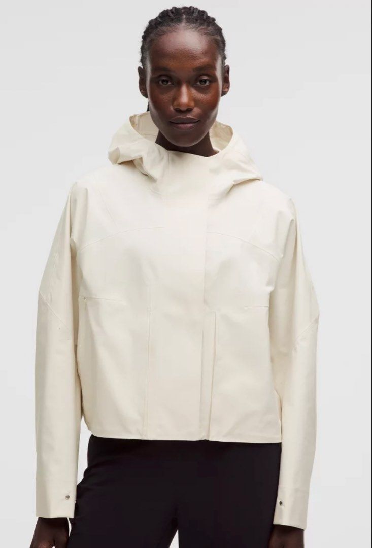Lululemon Rain Chaser Jacket Ivory size 4 (Category: Coats, Jackets and Outerwear) located in Taguig. Submitted by ellejay8 (Listing ID 1466445863, Image 1). Description: Authentic!!! from Lululemon Milan Italy. Check lululemon Website for details - Color: Light Ivory - Style: Clean minimalist cropped rain jacket - Material: Waterproof finish - Features: Built-in hood, structured panels, and snap-button cuffs - Closure: Front zipper concealed beh
