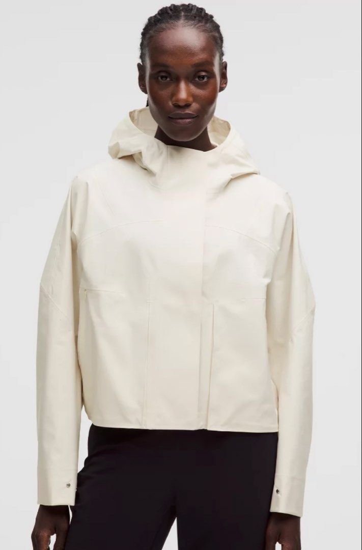 Lululemon Rain Chaser Jacket Ivory size 4 (Category: Coats, Jackets and Outerwear) located in Taguig. Submitted by ellejay8 (Listing ID 1466445863, Image 3). Description: Authentic!!! from Lululemon Milan Italy. Check lululemon Website for details - Color: Light Ivory - Style: Clean minimalist cropped rain jacket - Material: Waterproof finish - Features: Built-in hood, structured panels, and snap-button cuffs - Closure: Front zipper concealed beh