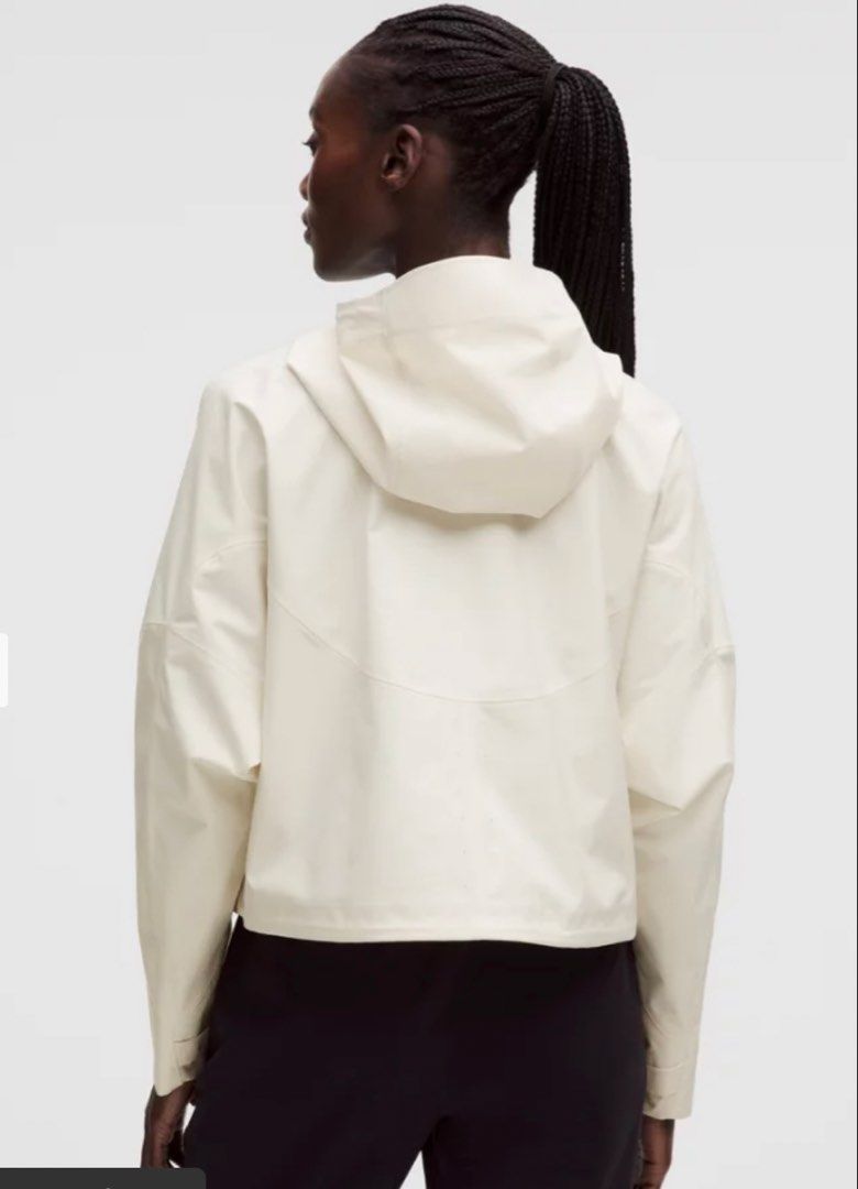 Lululemon Rain Chaser Jacket Ivory size 4 (Category: Coats, Jackets and Outerwear) located in Taguig. Submitted by ellejay8 (Listing ID 1466445863, Image 2). Description: Authentic!!! from Lululemon Milan Italy. Check lululemon Website for details - Color: Light Ivory - Style: Clean minimalist cropped rain jacket - Material: Waterproof finish - Features: Built-in hood, structured panels, and snap-button cuffs - Closure: Front zipper concealed beh