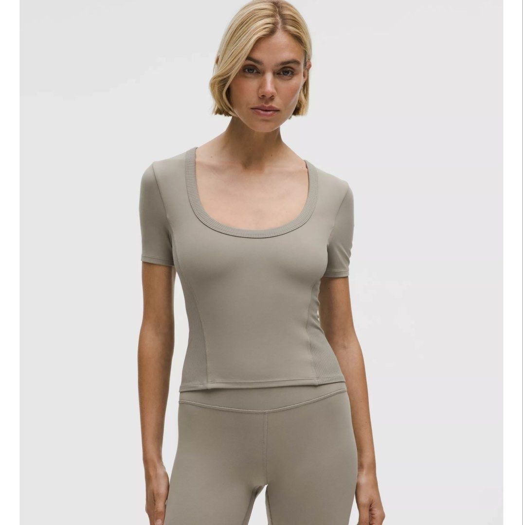 Lululemon Smooth and Ribbed Nulu square dot 4 (Category: Activewear) located in Iba. Submitted by xooperfindslb (Listing ID 1465896934, Image 2). Description: Smooth and Ribbed Nulu™ Women’s Sporty Low-Neck Short-Sleeve T-Shirt Square Dot 4 new release Preloved unused 2,280 each Black - available Warm umber gray - available With pad and padslot Can pass as new No issue .