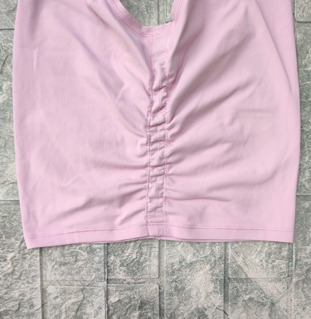 lululemon Tank Top (Category: Sleeveless) located in Bayambang. Submitted by mon10192816 (Listing ID 1466466091, Image 3). Description: - Width 15¾ - Length 18 - Brand: Lululemon - Style: Crew neckline, sleeveless, ruched side details for a flattering shape - Logo: Silver reflective logo on upper back - Fabric: Soft, high-performance athletic material - Versatility: Great for workouts, gym sessions, or daily casual wear - Pairing: Easy to style w