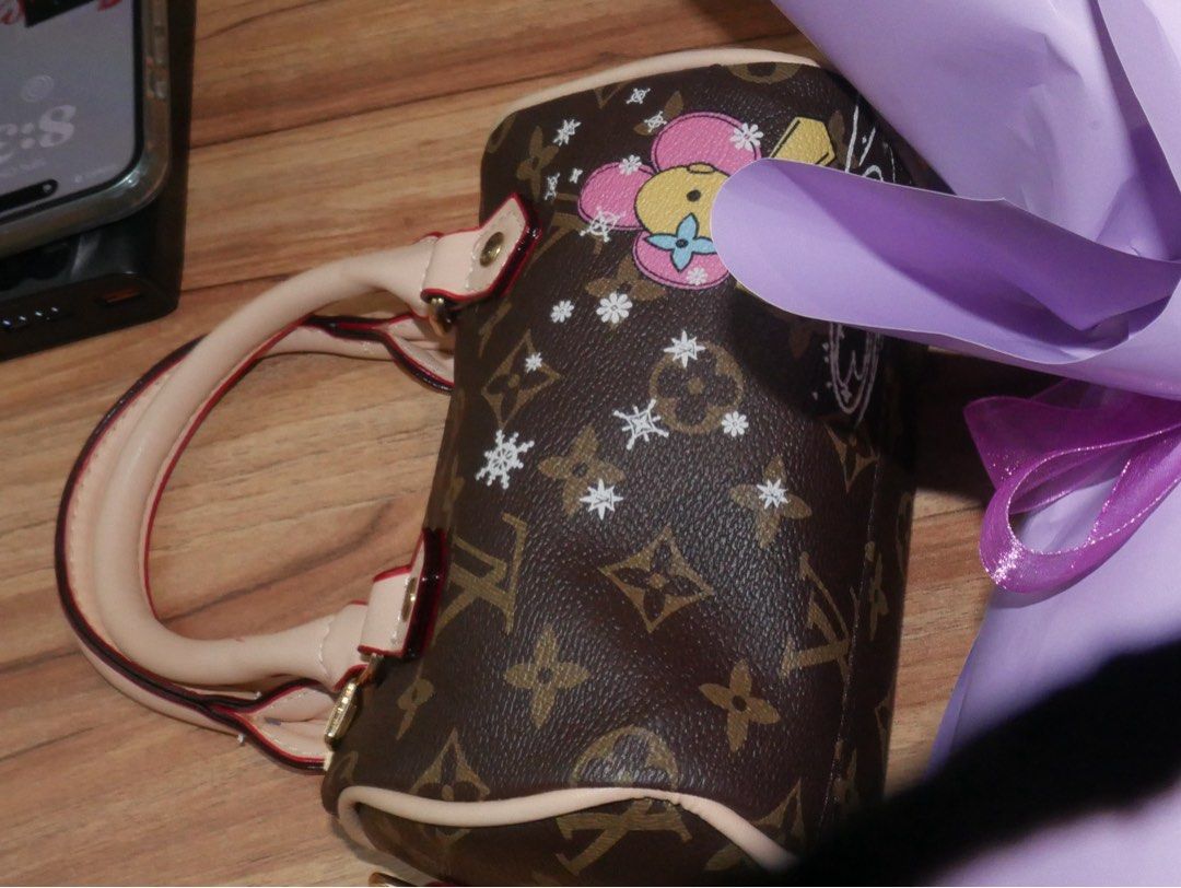 LV Speedy (Category: Luxury Bags & Wallets) located in Subic. Submitted by jujucndy (Listing ID 1466435040, Image 2). Description: NGA! This was just gifted to me before my grad. - monogram canvas with beige leather handle - Gold hardware - can fit your wallet, a powder, travel size perfume, and a pocket sized power bank. - no issues Rfs: need funds. price is negotiable, dm me..
