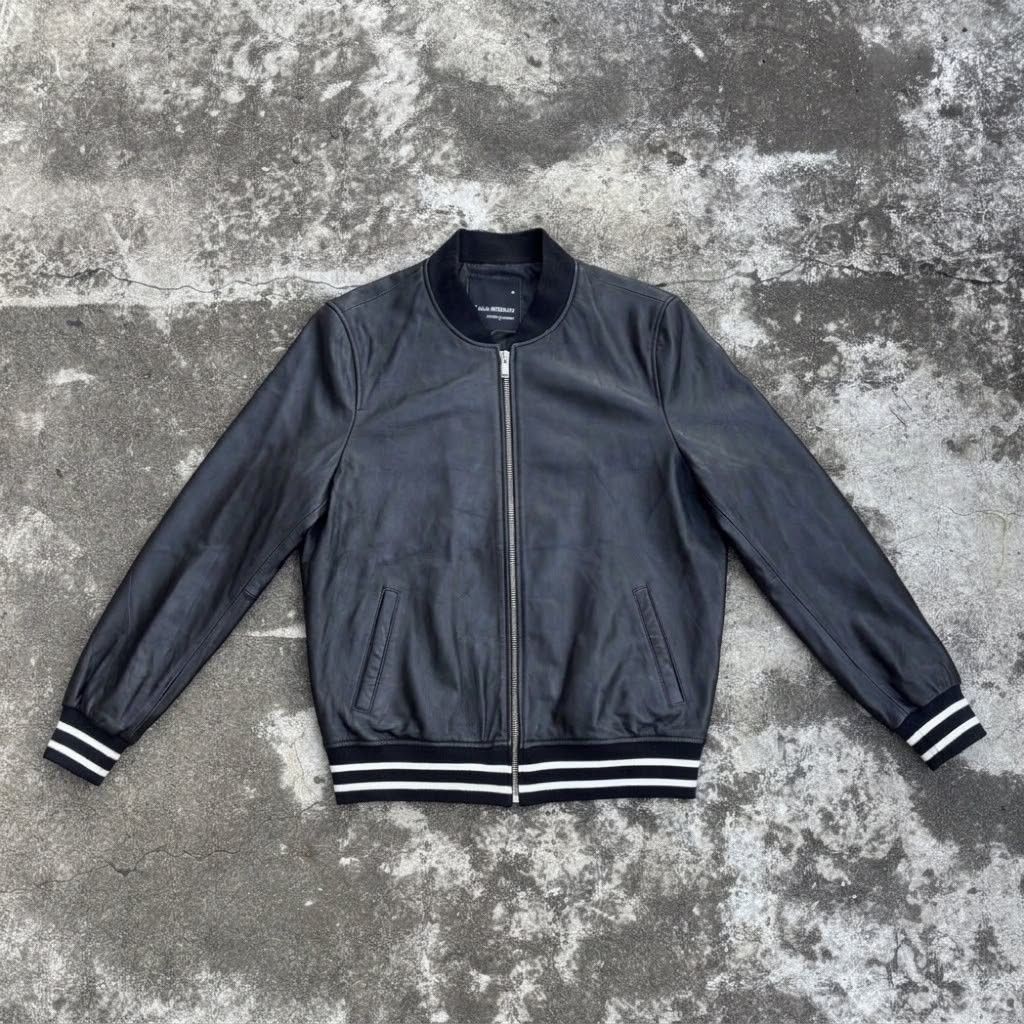 (M) gu.seemio Sheep Skin Leather Bomber Jacket (Category: Coats, Jackets and Outerwear) located in Bantay. Submitted by db_clothing (Listing ID 1466535619, Image 1). Description: - Brand: GU.SEEMIO - Material: 100% Genuine Leather (Black) - Design: Classic streetwear bomber with white stripe ribbed collar, cuffs, and hem - Features: Front zip closure, two welt pockets, fully lined interior - Measurements (approximate): Shoulder width 18", Chest w