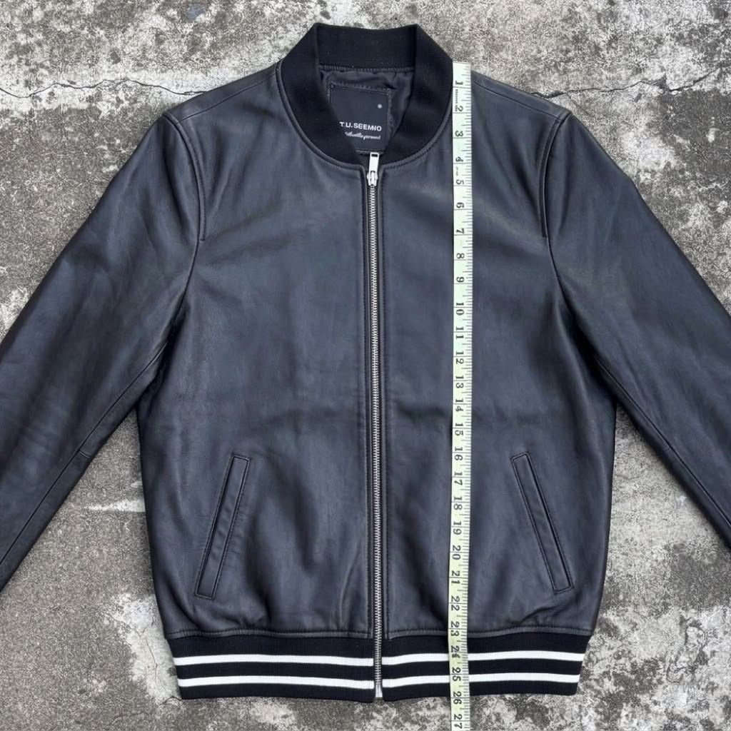 (M) gu.seemio Sheep Skin Leather Bomber Jacket (Category: Coats, Jackets and Outerwear) located in Bantay. Submitted by db_clothing (Listing ID 1466535619, Image 3). Description: - Brand: GU.SEEMIO - Material: 100% Genuine Leather (Black) - Design: Classic streetwear bomber with white stripe ribbed collar, cuffs, and hem - Features: Front zip closure, two welt pockets, fully lined interior - Measurements (approximate): Shoulder width 18", Chest w