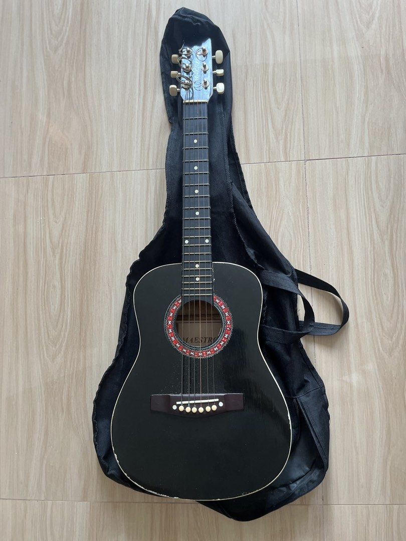 Maestro Acoustic Mini Guitar (Category: Musical Instruments) located in Tanza. Submitted by morbita (Listing ID 1466357781, Image 1). Description: Maestro Mini Guitar - mini guitar (body is 14.5" L and 11" W; 80cm long) - has stratches and dents all over - with guitar bag 🧧: BPI, GCash, Maya, and Landbank 🚘 : J&T, Flash Express, LBC, and any SDD.