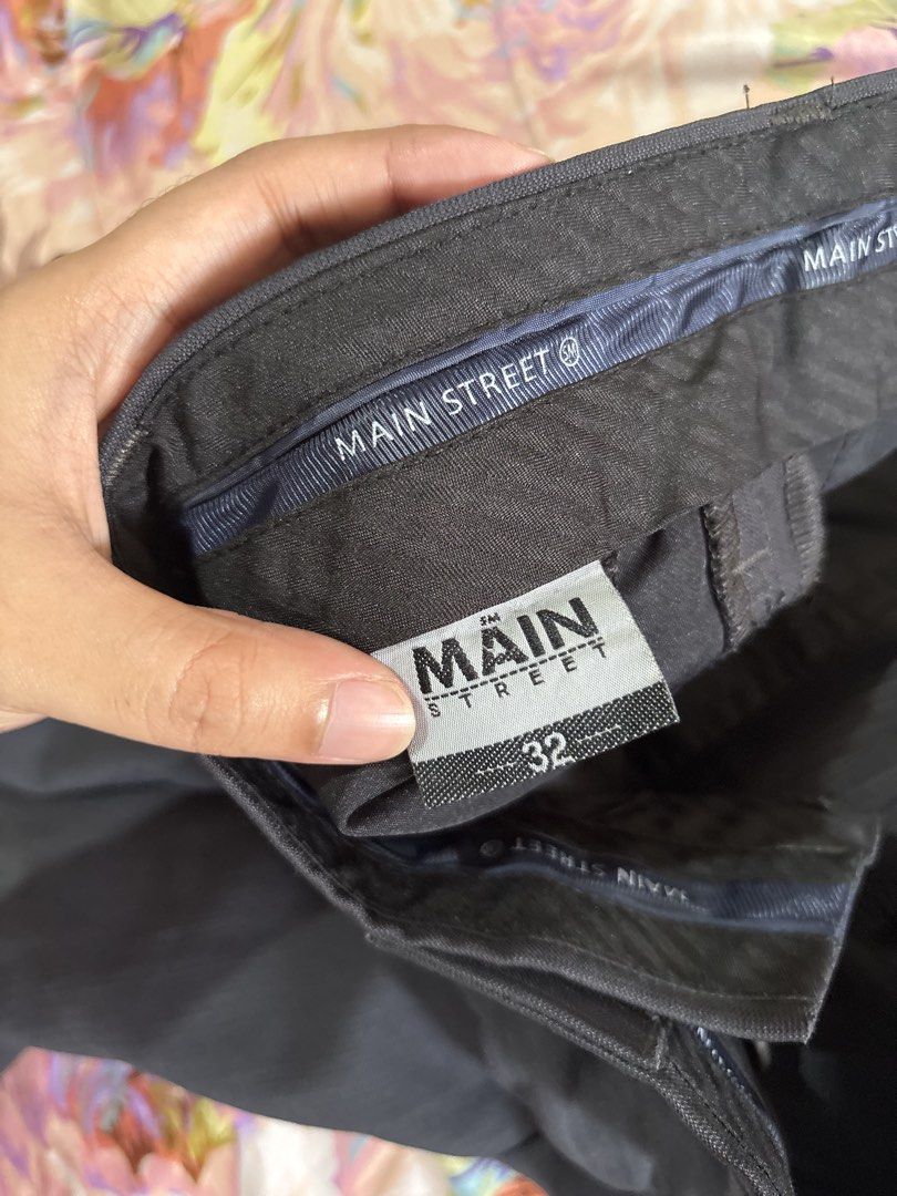 Main Street Black Trousers Size 32 (Category: Trousers) located in Paranaque City. Submitted by delikaite (Listing ID 1466397966, Image 3). Description: - Brand: Main Street - Size: 32 waistband - Fit: Straight leg cut with belt loops - Closure: Standard zip fly and button - Pockets: Two back welt pockets with button fastenings - Fabric: Lightweight with subtle texture - Condition: Clean, ready to wear for work or casual outings.