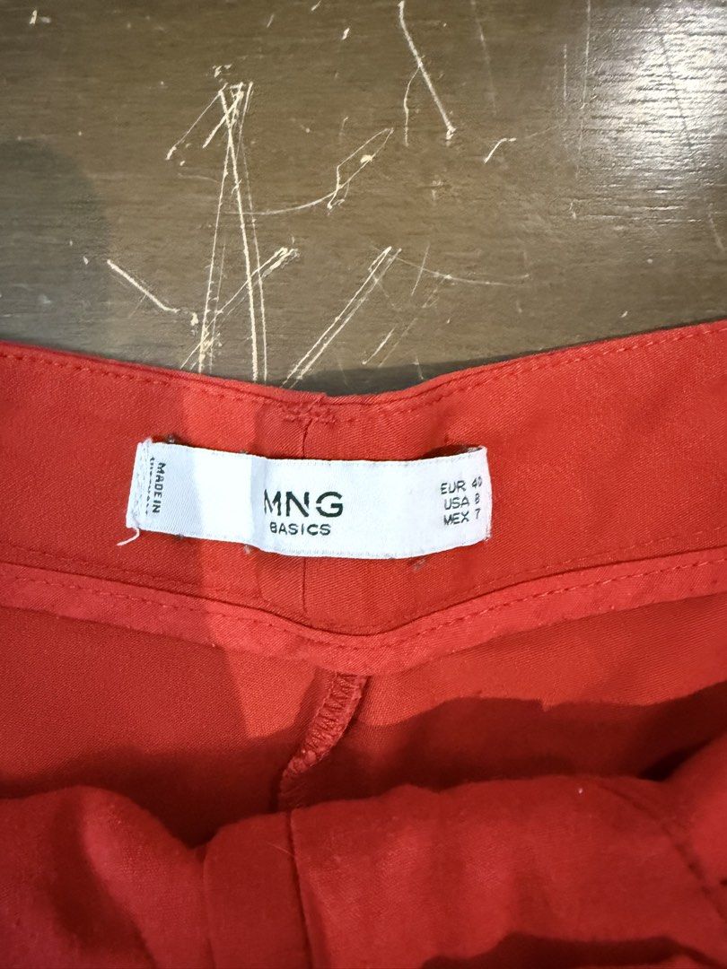 Mango Basics Red Shorts Size US 8 EUR 40 (Category: Shorts) located in Quezon City. Submitted by nsseller (Listing ID 1466461788, Image 2). Description: - Brand: Mango Basics - Size: EUR 40 / USA 8 / MEX 7 - Color: Bright red - Closure: Front button with zipper fly - Pockets: Functional side pockets - Details: Cute button tab accents near leg openings - Condition: Clean and vibrant, ideal for warm weather.