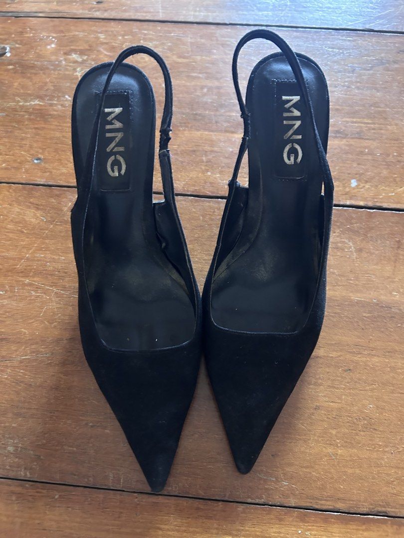 Mango Black Suede Slingback Heels (Category: Heels) located in Cebu City. Submitted by shopmikascloset (Listing ID 1466362412, Image 2). Description: - Brand: MNG - Style: Slingback heels with pointed toes and stiletto heels - Color: Classic black - Condition: Well-loved ; slight scuffing on heel tips and soles, clean upper material - Ideal for: Work, formal events, or smart-casual wear.