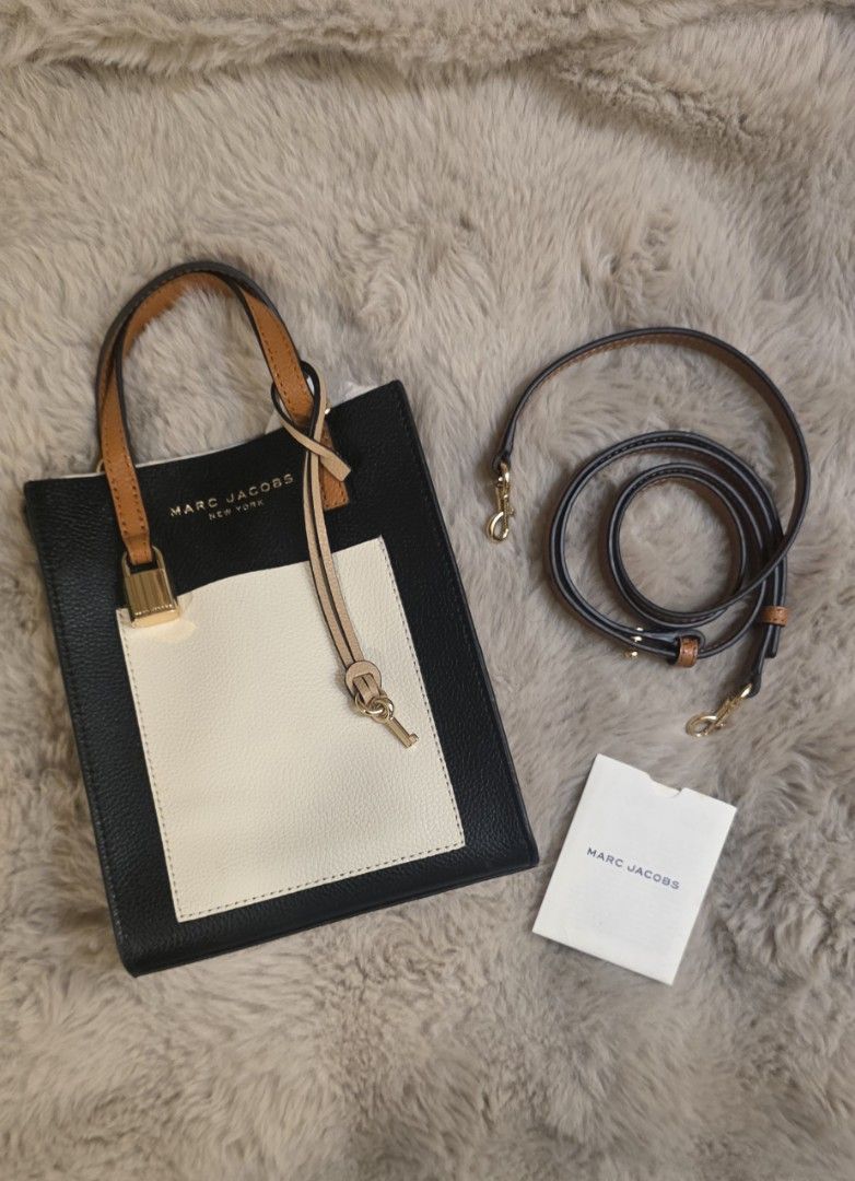 Marc Jacobs Leather Tote Bag (Category: Luxury Bags & Wallets) located in Pasay City. Submitted by erianodiegna (Listing ID 1466406080, Image 1). Description: ✨ FOR SALE: Marc Jacobs Mini Grind Tote Bag in 'Smoked Almond' (Tricolor) ✨ Selling an authentic, pre-loved Marc Jacobs Mini Grind tote bag in the gorgeous Smoked Almond tricolor scheme (Black, Cream, and Tan pebbled leather with gold-tone hardware)! 📌 Item Details: * Model: Marc Jacobs Mi