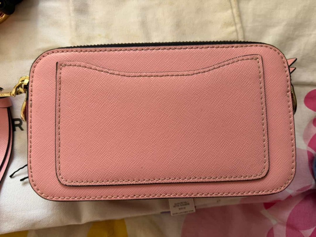 Marc Jacobs Snapshot Camera Bag Pink Red Gold (Category: Luxury Bags & Wallets) located in Caloocan City. Submitted by caeln (Listing ID 1466482212, Image 3). Description: - With tags and dust bag included - Stunning pink, red, and metallic gold colorway with iconic double J logo - Comfortable chunky woven shoulder strap with pink and red - Dual zip compartments and convenient exterior back slip pocket - Bought in Japan 2019 for Php15k - Has scra