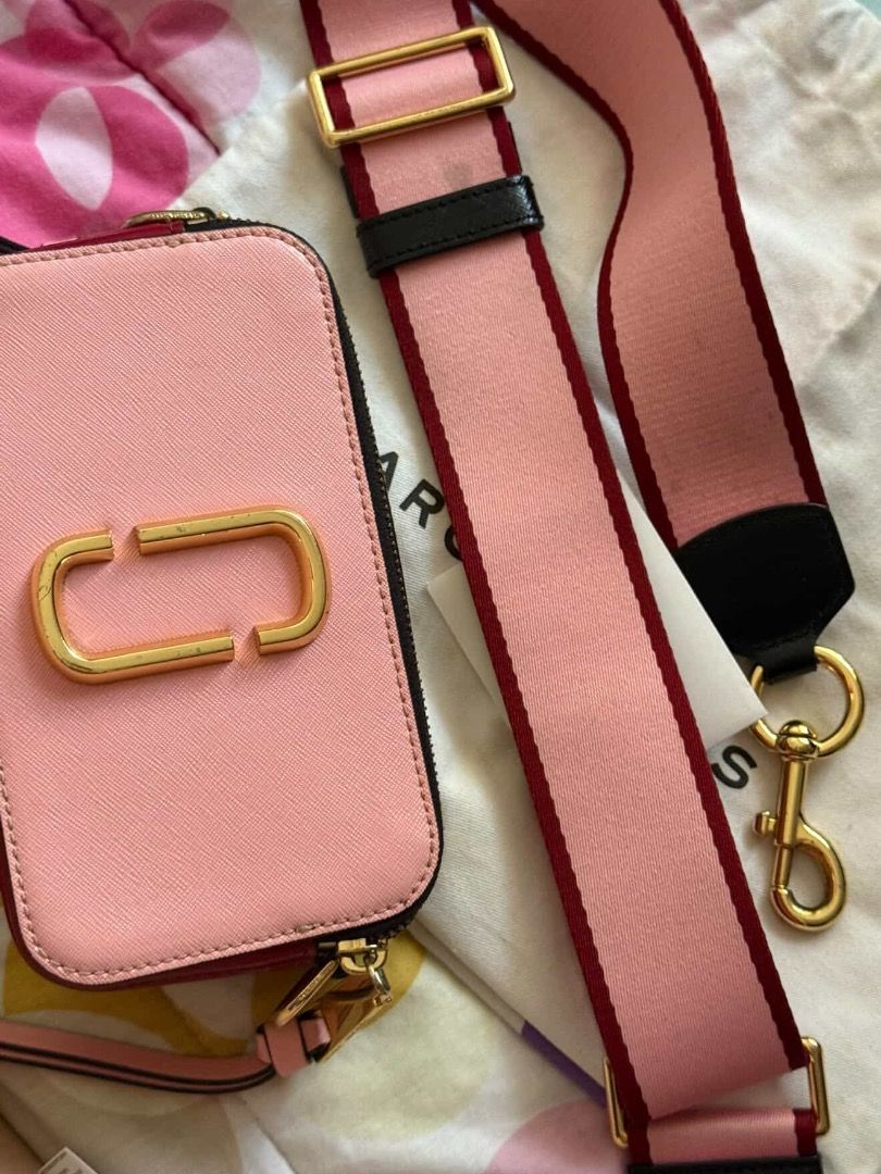 Marc Jacobs Snapshot Camera Bag Pink Red Gold (Category: Luxury Bags & Wallets) located in Caloocan City. Submitted by caeln (Listing ID 1466482212, Image 2). Description: - With tags and dust bag included - Stunning pink, red, and metallic gold colorway with iconic double J logo - Comfortable chunky woven shoulder strap with pink and red - Dual zip compartments and convenient exterior back slip pocket - Bought in Japan 2019 for Php15k - Has scra