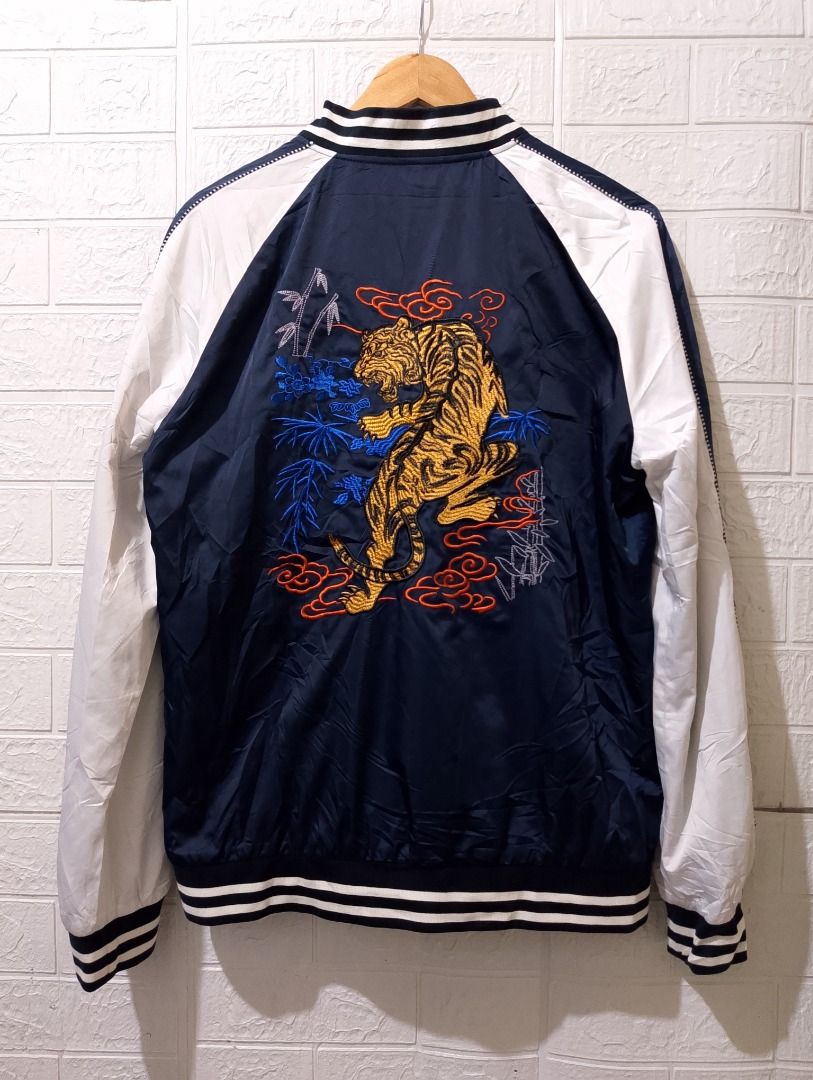 Mark Fairwhale Tiger Embroidery Sukajan Bomber Jacket L (Category: Coats, Jackets and Outerwear) located in Cavite. Submitted by marvzclothing (Listing ID 1466460310, Image 2). Description: - Brand: Mark Fairwhale - Color: Navy and white - Design: Detailed tiger embroidery with bamboo and cloud motifs on the back - Closure: Full front zip with branded pull tab - Trims: Ribbed striped collar, cuffs, and hem - Interior: Fully lined with an inner bu