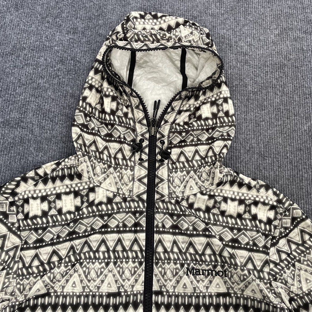 Marmot full-zip outdoor windbreaker jacket (Category: Coats, Jackets and Outerwear) located in Iloilo. Submitted by 3ift2heav3n (Listing ID 1466456640, Image 3). Description: Marmot full-zip outdoor windbreaker jacket by featuring an intricate geometric Aztec-style or Navajo-inspired tribal pattern in black, white, and beige. Authentic/original Like new condition No flaw's Waistline 22 Lenght 28.