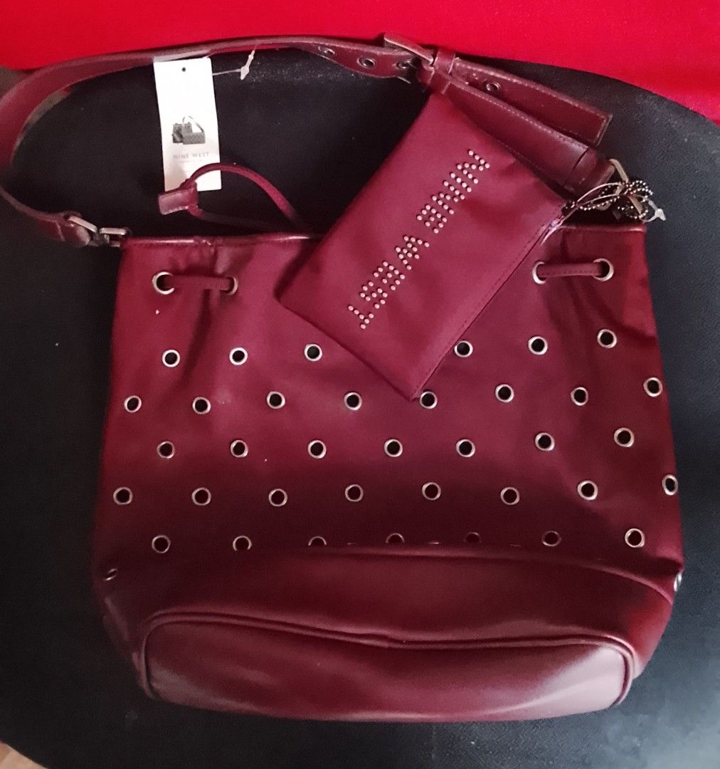 Maroon Drawstring Bucket Bag with Studded Pouch (Category: Purses & Pouches) located in Quezon City. Submitted by realassetph (Listing ID 1461461633, Image 1). Description: - Stylish maroon bucket bag - Features eyelets all around - Includes a matching studded pouch - Secure drawstring closure - Adjustable strap for comfort - Ideal for everyday wear Php 1,000 only other bags also available for sale buy individually or buy all bags for only Php 5k