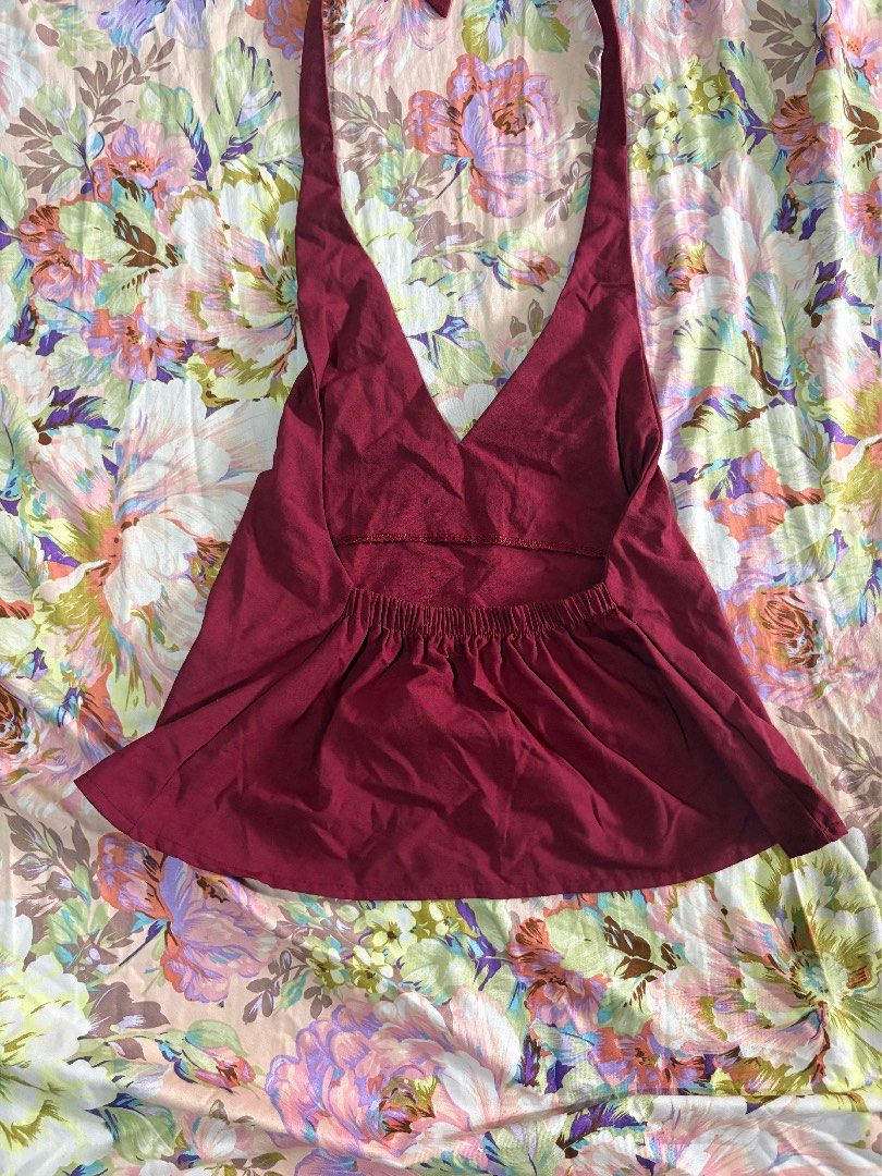 Maroon halter crop top with tie straps (Category: Sleeveless) located in Paranaque City. Submitted by delikaite (Listing ID 1466414573, Image 2). Description: - Color: Rich maroon / deep red - Design: Halter neck with long straps to tie behind the neck and back - Fit: Stretchy elastic band at the back for easy, comfortable wear - Fabric: Light and breathable, ideal for warm weather or layering - Style: Simple, solid, and versatile for casual outi
