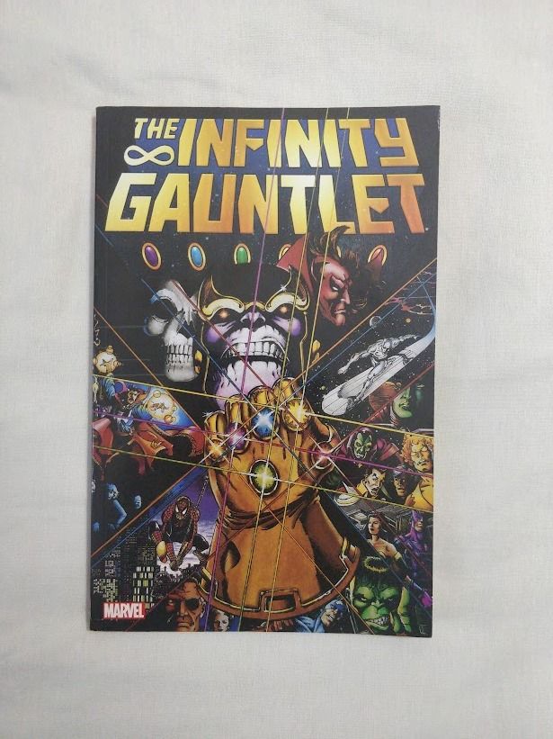 Marvel The Infinity Gauntlet Trade Paperback Comic Book (Category: Comics & Manga) located in Quezon City. Submitted by caduceus.dc (Listing ID 1466492413, Image 1). Description: - Title: The Infinity Gauntlet Trade Paperback (Collects Issues 1-6) - Creators: Written by Jim Starlin, Art by George Pérez & Ron Lim - Publisher: Marvel Comics (Standard softcover format) - Synopsis: Thanos wields the Infinity Stones against Earth's heroes in this lege