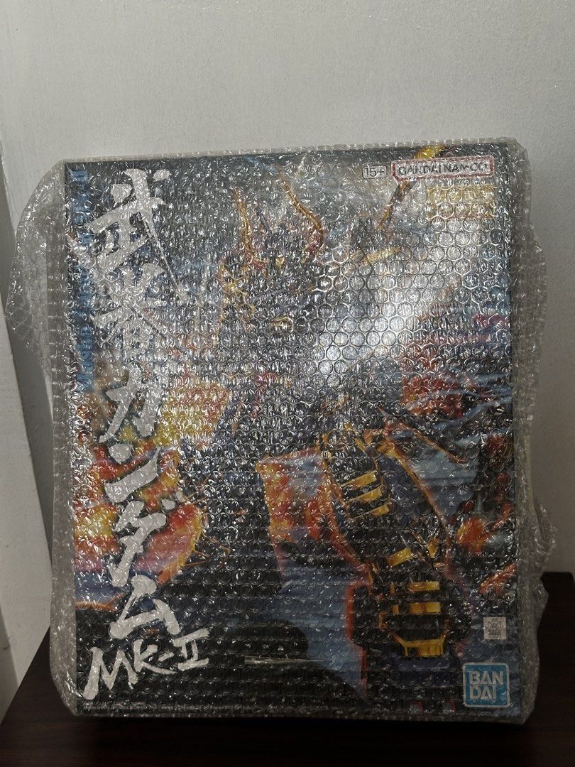 Master Grade (MG) 1/100 Musha Gundam Mk-II (Category: Gundam & Model Kits) located in Cavite. Submitted by debbieafrica (Listing ID 1466436882, Image 1). Description: - Item: Bandai Musha Gundam Mk-II Model Kit - Condition: Brand new, unopened box with untouched runners inside - Packaging: Still wrapped in original store bubble wrap - Design: Heavy samurai armor in dark blue and gold with iconic horned helmet and dual swords - Ideal for: Gunpla c