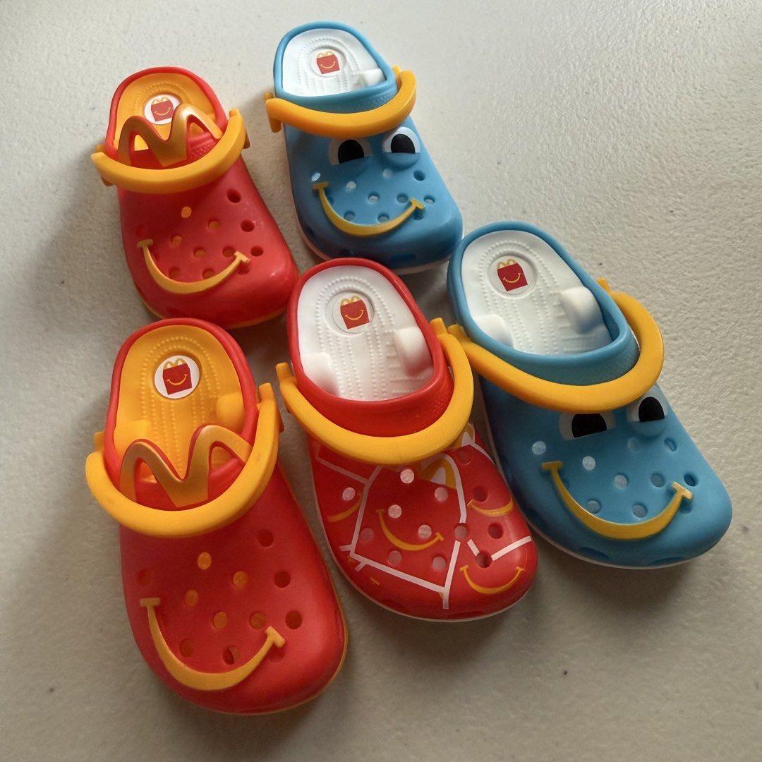 McDonalds Crocs Mini Keychain Toy Set (Category: Character Goods) located in Manila. Submitted by cheemkenn (Listing ID 1466428222, Image 1). Description: - RFS: these are my duplicates - ₱50 each, but ₱150 to take ALL 5 crocs keychain - Full set of McDonald's mini Crocs keychains - Features classic blue, red, and patterned designs - Complete with tiny Crocs sole branding, smiley faces, and yellow straps - Includes white attachment rings for easy