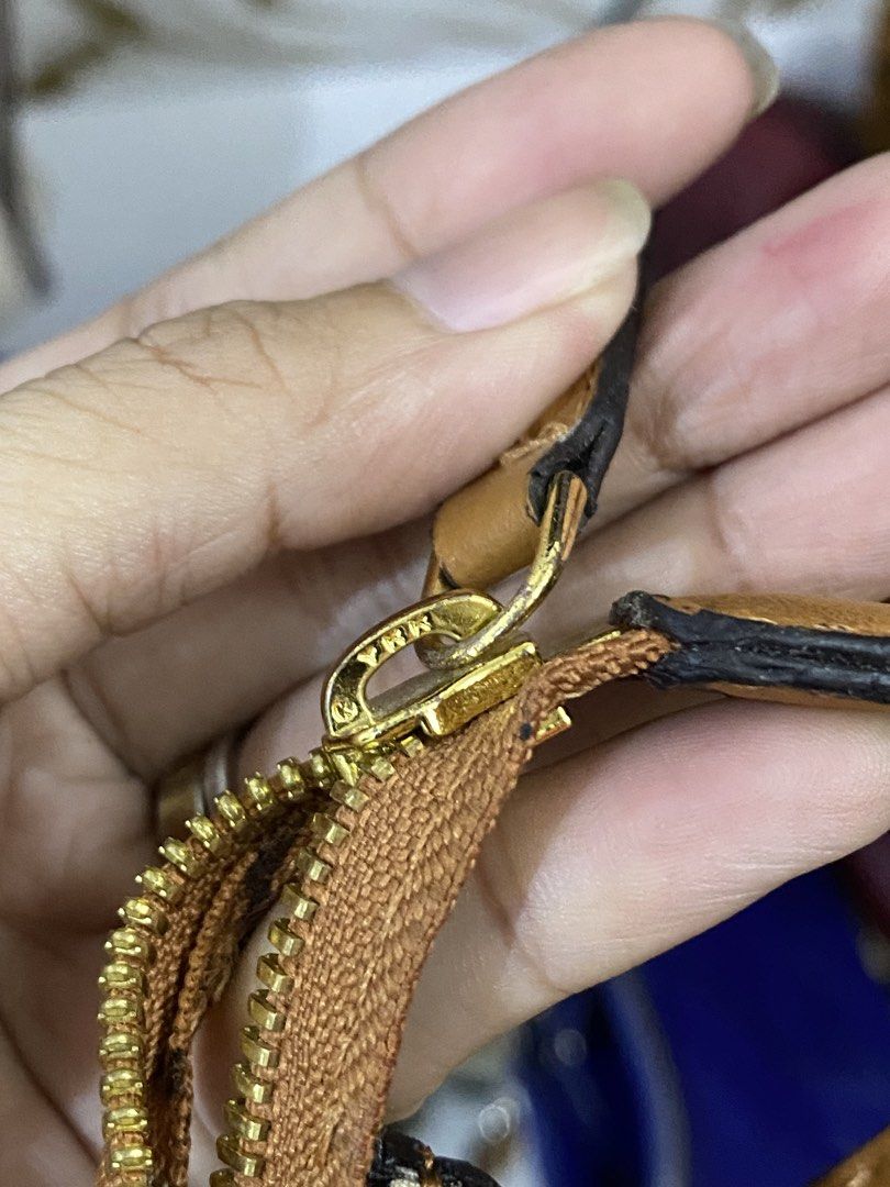 MCM Visetos Monogram Cognac Brown Shoulder Bag (Category: Luxury Bags & Wallets) located in Manila. Submitted by grandowl_5653cd (Listing ID 1466526384, Image 3). Description: Cognac brown MCM shoulder bag with classic all-over Visetos monogram print and dark diamond motifs. Gold-tone hardware with YKK zippers and engraved pull tabs. Geometric patterned fabric lining inside. Slim rectangular shape with single adjustable strap. Clean condition thr