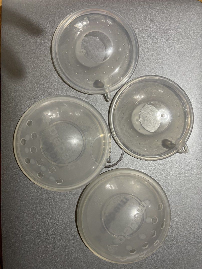 Medela Breast Shells Nursing Cups Set (Category: Breastfeeding & Bottle Feeding) located in Manila. Submitted by chogarcookie (Listing ID 1466387227, Image 1). Description: - Set of four genuine Medela nursing shells - Swiss-made durable translucent plastic - Ventilation holes along the rim for proper airflow - Designed to collect leaking milk and protect sore nipples - Easy to clean and sterilize between uses - Great and reliable backup set for 