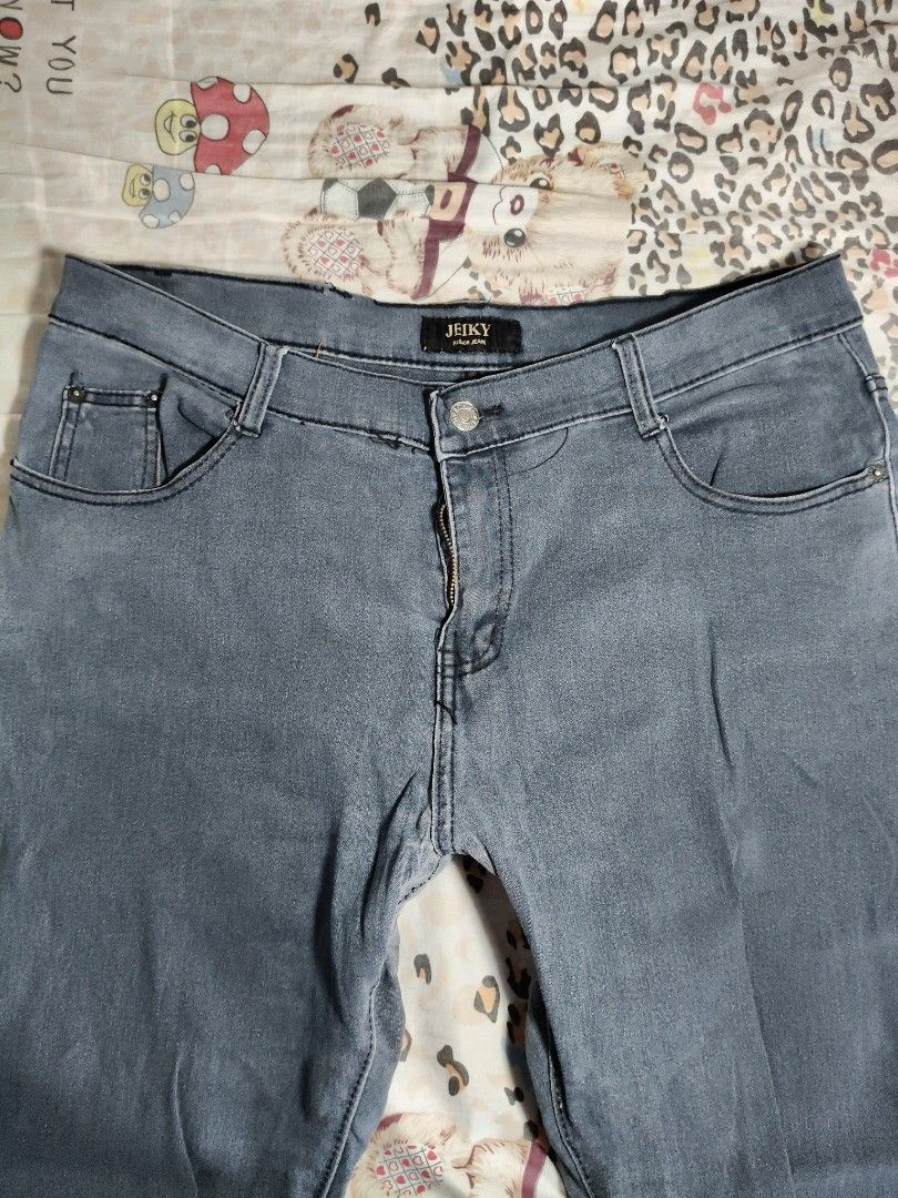 Men's Distressed Slim-Fit Jeans (Category: Jeans) located in Lapu Lapu. Submitted by hooman422 (Listing ID 1466562558, Image 3). Description: • Product: Distressed denim jeans • Color: Grayish dark blue wash • Style: Regular/slim straight-leg fit • Distress details: Prominent horizontal cut-outs/slits at both knees with frayed edges • Design elements: Classic five-pocket configuration, standard belt loops, and center button closure with front zip