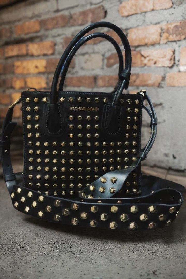 Mercier studded leather (Category: Cross-body Bags) located in San Juan City. Submitted by bellarina05 (Listing ID 1466403145, Image 1). Description: Cleaning out my closet! Michael Kors Studio Mercer Studded Leather Crossbody Messenger structured purse. This is sold as a medium size purse but I would call it small. Black with silver studs. Middle zippered divider pocket with card slots on side. Excellent condition bag, handles could use a light 