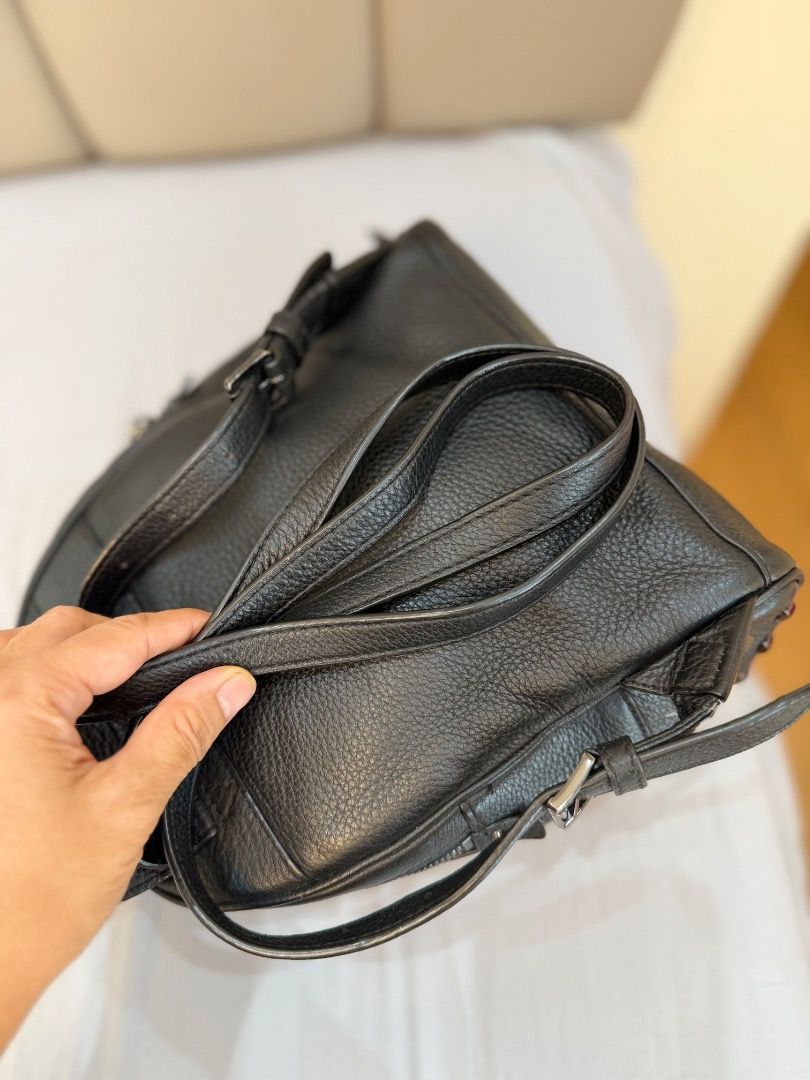 Michael Kors Black Studded Leather Backpack (Category: Backpacks) located in Rizal. Submitted by je_resada (Listing ID 1466345116, Image 3). Description: - Black pebbled leather backpack - Chic silver-tone metal studs along the bottom - Front zip pocket and sturdy top handle - Interior lined with convenient slip pockets - Compact size, perfect for everyday carry - 100% working smooth zipper closures.