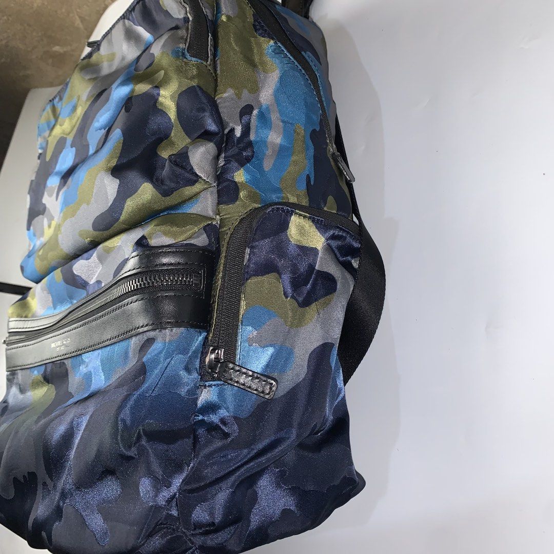 Michael Kors Kent Camouflage Nylon Backpack (Category: Luxury Bags & Wallets) located in Ivisan. Submitted by trashtotreasuree (Listing ID 1466396107, Image 2). Description: Rank A No issue Sobrang linis pa.