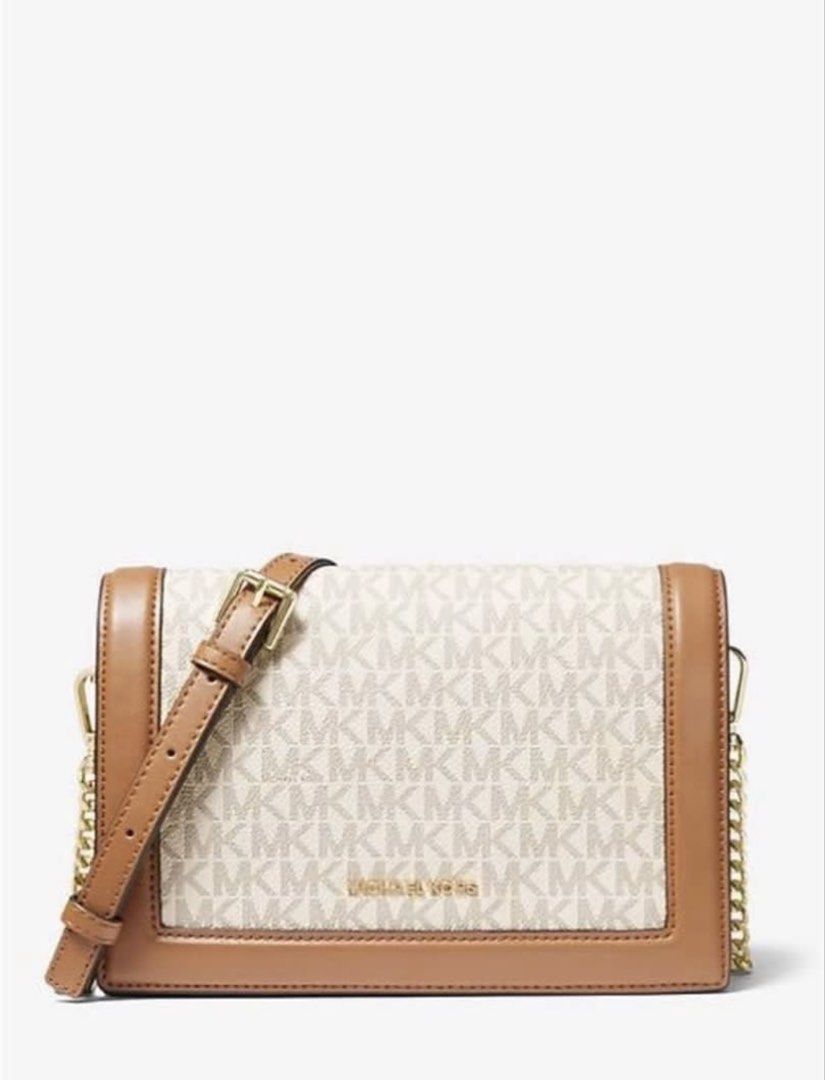 Michael Kors MK Logo Crossbody Bag (Category: Cross-body Bags) located in Lapu Lapu. Submitted by happyfox_d8cb2d (Listing ID 1466419528, Image 1). Description: Michael Kors crossbody bag in signature vanilla and acorn brown monogram canvas. Tan leather trim, gold-tone hardware. Front flap closure with magnetic snap. Adjustable buckle shoulder strap with chain link details. Inside has a zip pocket and slip pocket. Neutral colorway matches everyth