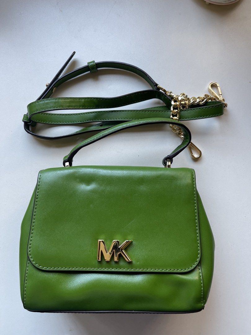 Michael Kors Vibrant Green Satchel Bag (Category: Luxury Bags & Wallets) located in Manila. Submitted by fionaret (Listing ID 1466412080, Image 3). Description: - Brand: Michael Kors - Style: Vibrant Green Satchel / Handbag / Crossbody - Color: Eye-catching vibrant green with gold-tone hardware and signature MK logo - Material: Premium structured leather with clean interior fabric lining featuring Michael Kors branding - Versatility: Includes a s