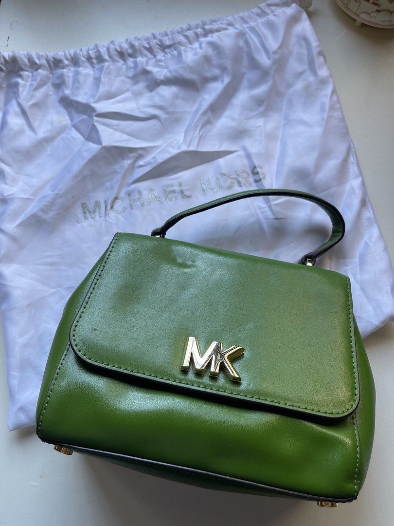 Michael Kors Vibrant Green Satchel Bag (Category: Luxury Bags & Wallets) located in Manila. Submitted by fionaret (Listing ID 1466412080, Image 1). Description: - Brand: Michael Kors - Style: Vibrant Green Satchel / Handbag / Crossbody - Color: Eye-catching vibrant green with gold-tone hardware and signature MK logo - Material: Premium structured leather with clean interior fabric lining featuring Michael Kors branding - Versatility: Includes a s