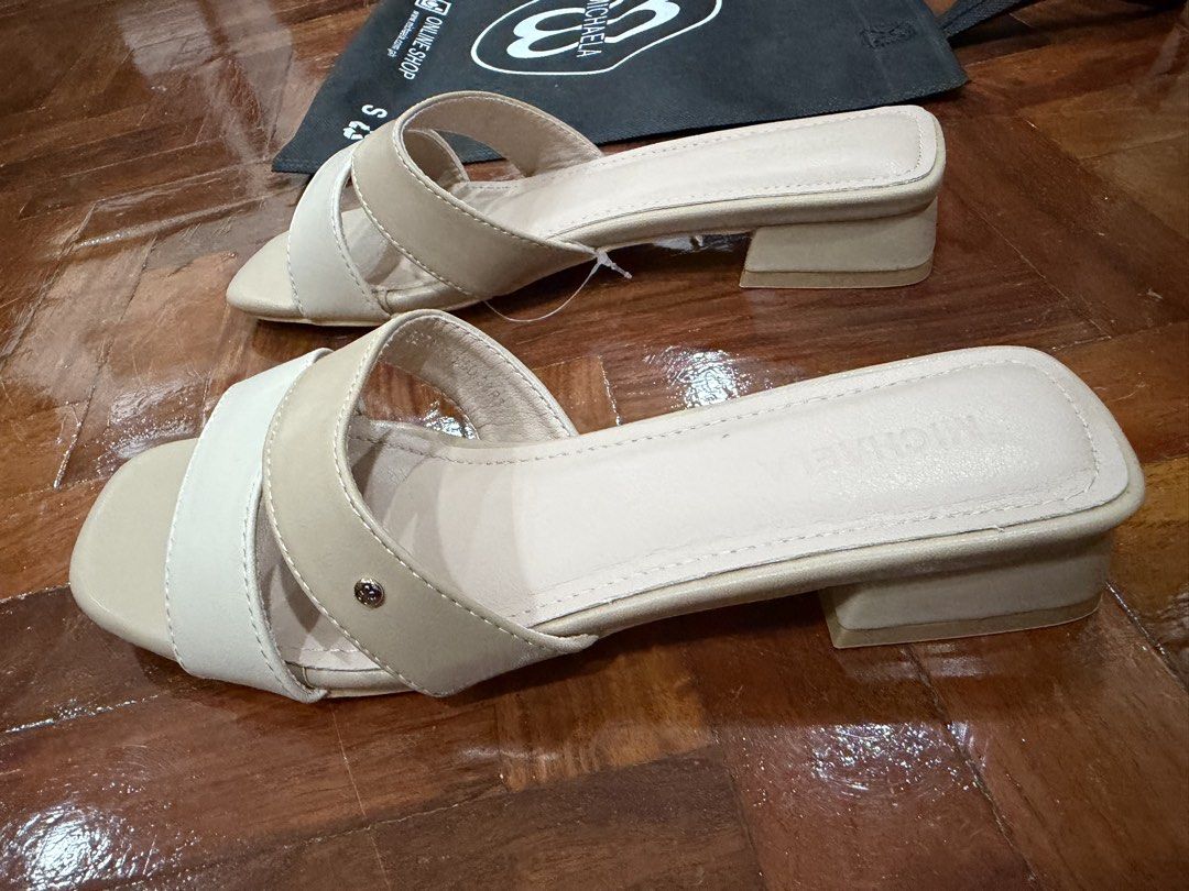 Michaela Two-Tone Low Heel Sandals Size 38 (Category: Flats & Sandals) located in Manila. Submitted by jay_bee888 (Listing ID 1466376418, Image 3). Description: -Bnew ( sinukat lang ) - Style: Two-tone beige and cream block heel sandals with square toe and crisscross straps - Size: 38 - Inclusions: Original box and Eco Bag.
