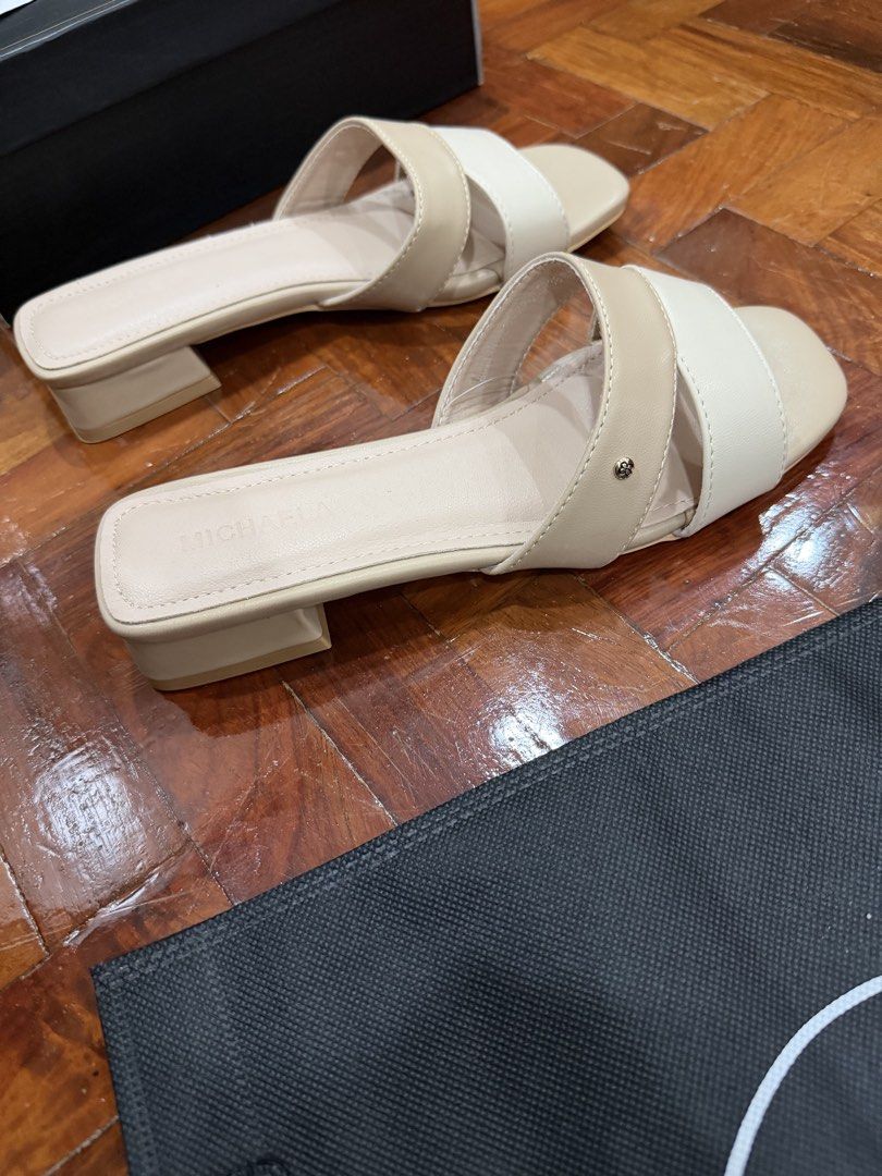 Michaela Two-Tone Low Heel Sandals Size 38 (Category: Flats & Sandals) located in Manila. Submitted by jay_bee888 (Listing ID 1466376418, Image 2). Description: -Bnew ( sinukat lang ) - Style: Two-tone beige and cream block heel sandals with square toe and crisscross straps - Size: 38 - Inclusions: Original box and Eco Bag.