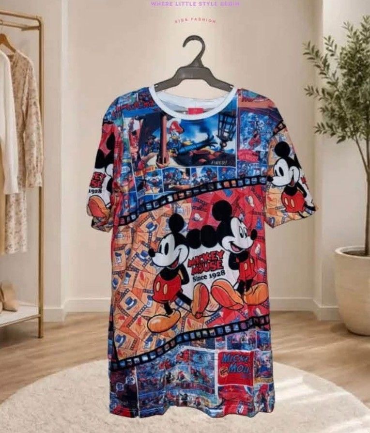Mickey Mouse All-Over Print T-Shirt (Category: Shirts) located in Famy. Submitted by bujoystyle16 (Listing ID 1466448740, Image 1). Description: - Design: Vibrant Mickey Mouse all-over print with classic vintage comic collage - Fit: Relaxed, comfortable oversized fit - Details: Classic round neckline and short sleeves - Material: Super soft and breathable fabric, perfect for everyday casual wear - Condition: Brand new / Excellent quality.