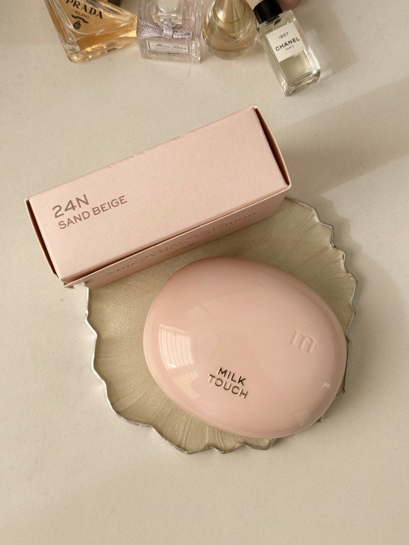 Milk Touch Makeup Cushion (Category: Makeup) located in Taguig. Submitted by kitty.bloom (Listing ID 1466389453, Image 2). Description: 🛒Brand: Milk Touch - Product: All-Day Skin Milky Glow Cushion - Shade: 24N Sand Beige - Net Weight: 0.52 oz / 15g - Condition: Brand new (opened box for product photography only) - Features: Includes built-in mirror, soft application puff, and a sleek pastel pink compact design - Finish: Dewy, natural glowing sk