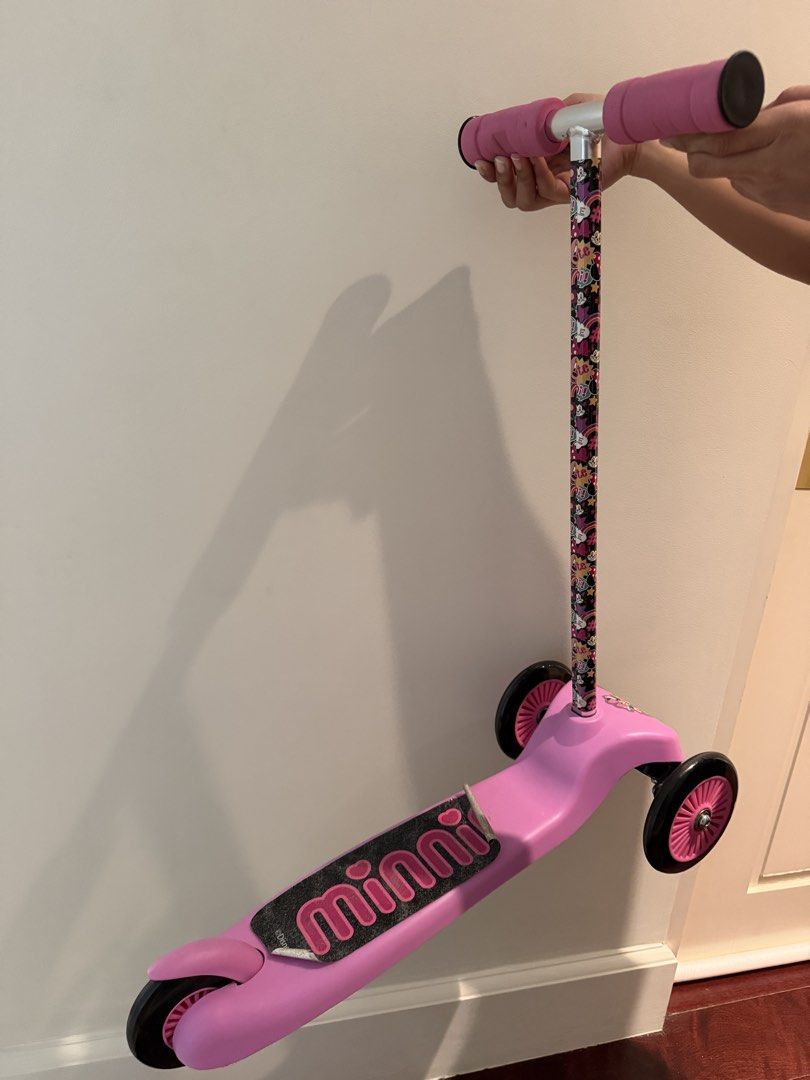 Minnie Mouse 3-Wheel Kick Scooter (Category: Skates, Rollerblades & Scooters) located in Makati City. Submitted by juju_08 (Listing ID 1466422731, Image 3). Description: - Authentic Disney Minnie Mouse pink 3-wheel scooter for kids - Dual front wheels provide extra stability for young riders - Fun cartoon graphics on handlebar pole and Minnie decal near front - Comfortable foam grip handles - Clean and ready to ride with slight wear on the back g