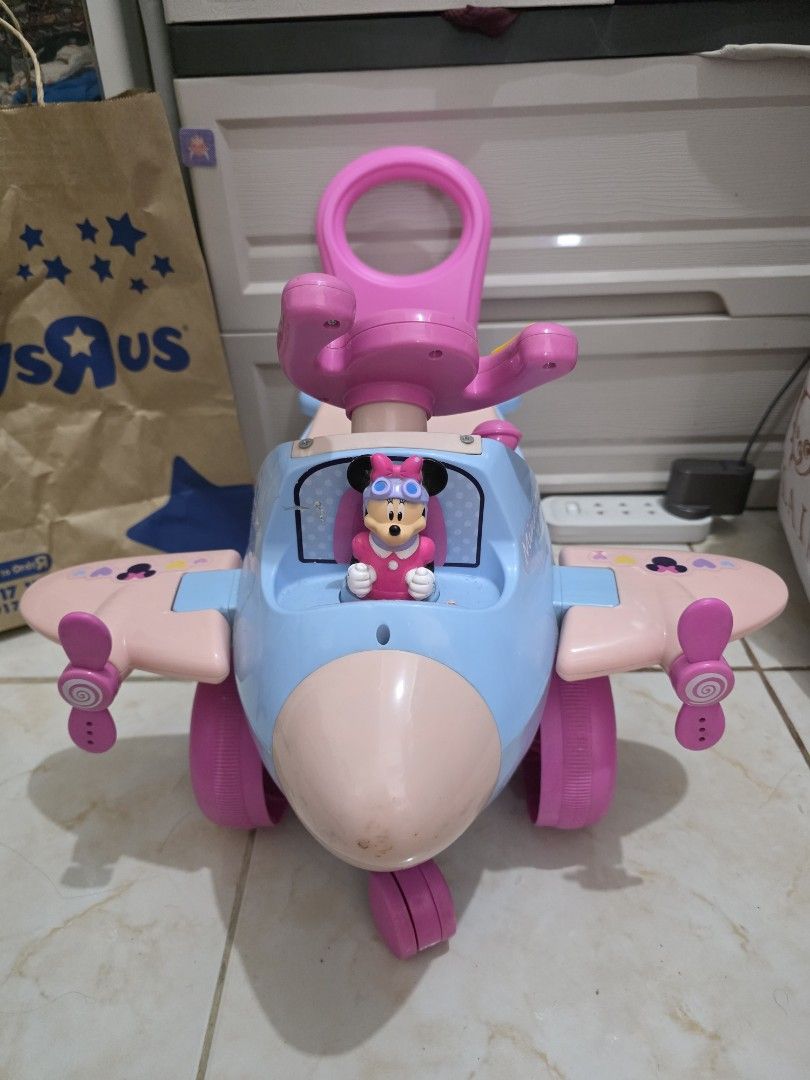 Minnie Mouse Ride-On Airplane Toy (Category: Kids Toys) located in Taguig. Submitted by jeaniper (Listing ID 1466363081, Image 1). Description: - Minnie Mouse toddler ride-on airplane in blue and pink - Features interactive buttons on the steering wheel and a built-in Minnie figure - Equipped with sturdy large pink wheels and a convenient push handle at the back - Perfect toy for toddlers to scoot around and play - Condition: Normal signs of use 