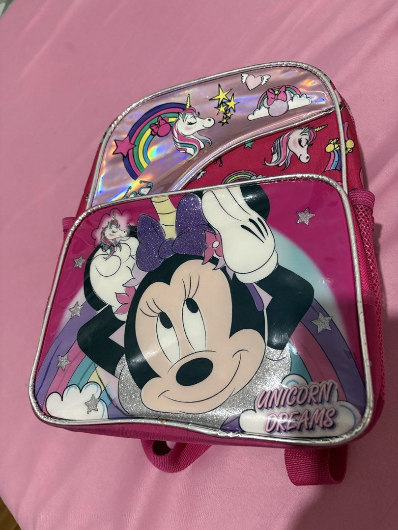 Minnie Mouse Unicorn Dreams Trolley Backpack Set (Category: Backpacks) located in Makati City. Submitted by littlepinkpony (Listing ID 1466562807, Image 3). Description: - 3-in-1 Set: Includes a large rolling trolley backpack, a detachable lunch bag, and a matching mini backpack - Design: Fun pink Minnie Mouse theme with magical unicorn graphics and a sparkly glitter bow detail - Eye-catching Finish: Trendy shiny holographic accents on the top po