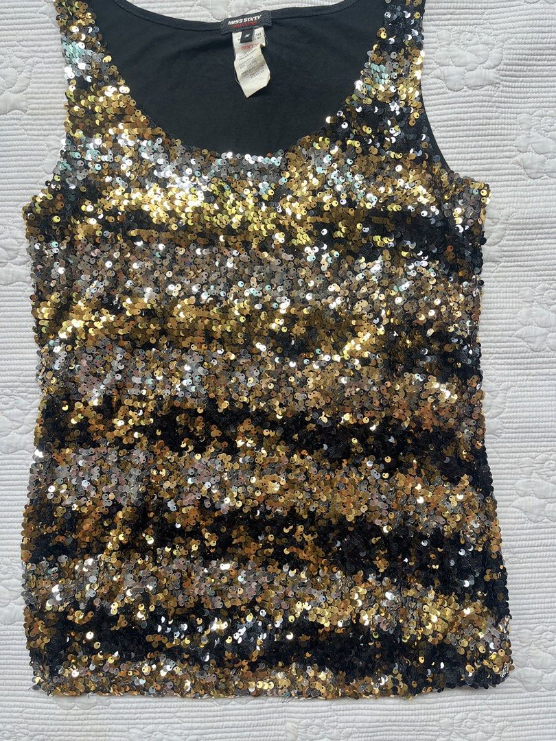Miss Sixty Black Gold Sequin Tank Top (Category: Sleeveless) located in Alabel. Submitted by geragarhea13830 (Listing ID 1466406746, Image 2). Description: - Brand: Miss Sixty - Design: Sleeveless tank top with scoop neckline - Details: Fully covered in gold, silver, and black sequins with a black fabric backing - Condition: Great statement piece, tag attached at the collar - Occasion: Perfect for parties, clubs, and nights out.