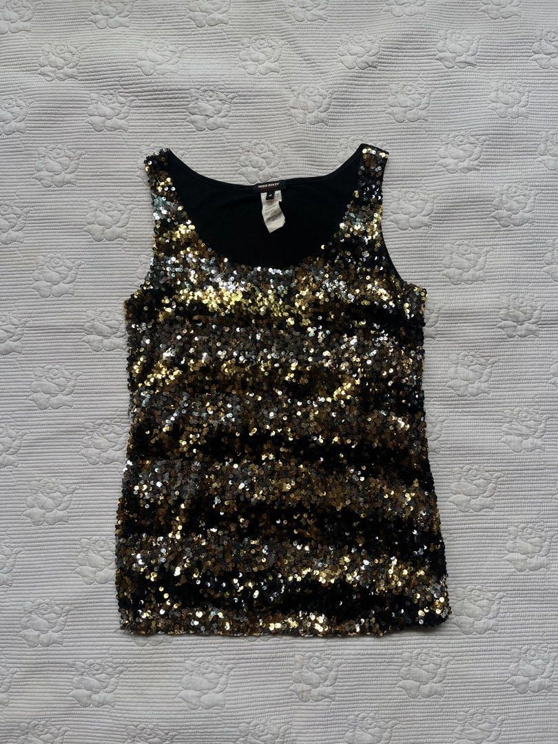 Miss Sixty Black Gold Sequin Tank Top (Category: Sleeveless) located in Alabel. Submitted by geragarhea13830 (Listing ID 1466406746, Image 3). Description: - Brand: Miss Sixty - Design: Sleeveless tank top with scoop neckline - Details: Fully covered in gold, silver, and black sequins with a black fabric backing - Condition: Great statement piece, tag attached at the collar - Occasion: Perfect for parties, clubs, and nights out.
