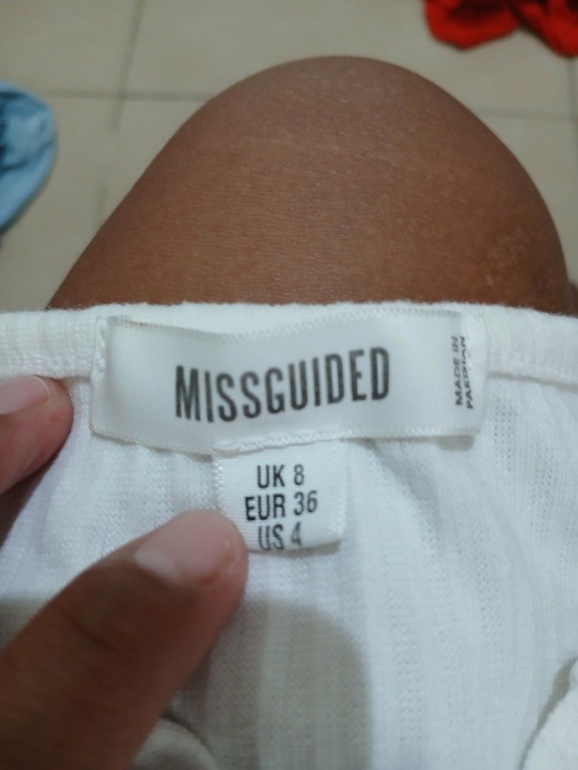 Missguided White Ribbed Long Sleeve Button Up Bodysuit (Category: Longsleeves) located in Manila. Submitted by relaxlang (Listing ID 1466398920, Image 2). Description: - Brand: Missguided - Style: Ribbed long-sleeve bodysuit with crew neckline and front button placket - Color: White - Size: UK 8 / EUR 36 / US 4 - Closure: Bottom snap buttons for easy wear - Origin: Made in Pakistan - Condition: Excellent.