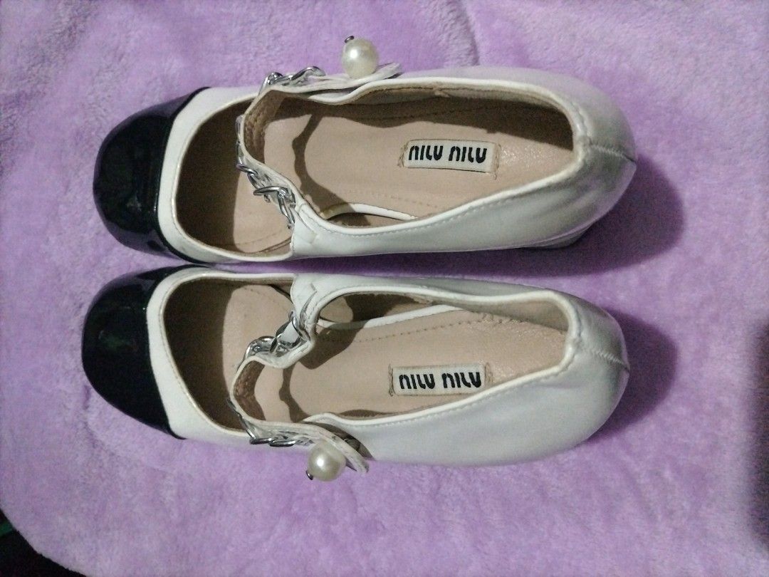 miu miu mary jane cap toe pumps (Category: Sneakers & Footwear) located in Valenzuela. Submitted by nurzdara28 (Listing ID 1466511729, Image 3). Description: These Mary Jane pumps are crafted in patent leather with a contrast leather cap toe that accentuates the round toe shape. The feminine style features a pearl button and silver-tone chain adorning the strap across the instep. Made in Italy, they are set on a sturdy, covered block heel for eve